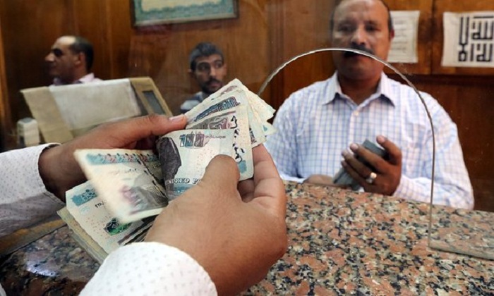 Egypt devalues currency by 48% to meet IMF demands for $12bn loan